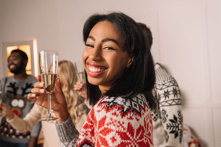 african american woman with glass of champagneの写真素材