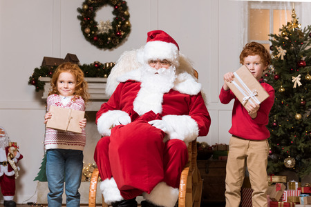 santa claus and children with presentsの写真素材
