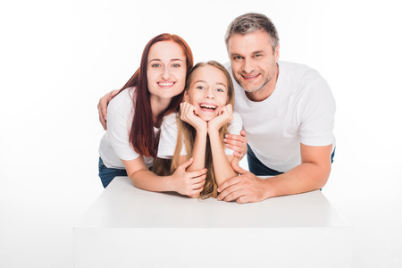 hugging young family