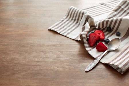 berries and spoon on napkin