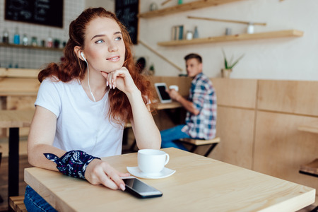 pensive girl in cafe
