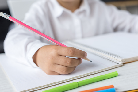schoolgirl doing homeworkの写真素材