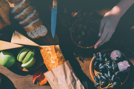 woman preparing wine snacksの写真素材