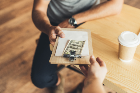 man paying for order in cafeの写真素材