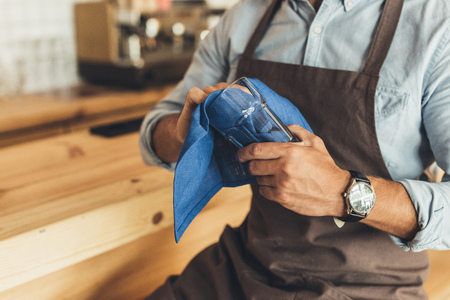 worker cleaning glasswareの写真素材