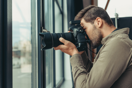 photographer with digital photo cameraの写真素材