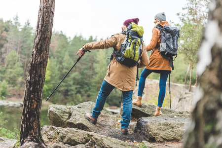 couple trekking in forestの写真素材