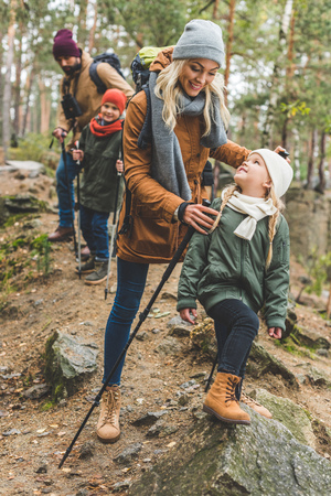 family walking in autumn forestの写真素材