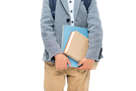 schoolboy with books and backpackの写真素材