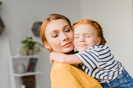 mother and daughter embracingの写真素材
