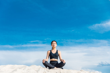 woman meditating in lotus poseの写真素材