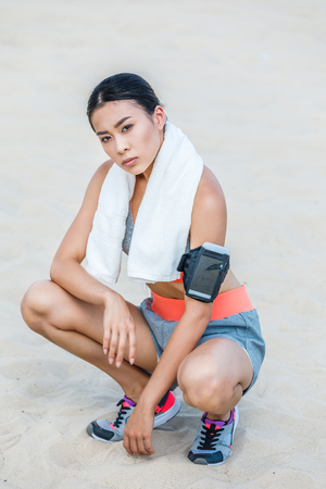 sportswoman with sport armband for smartphoneの写真素材