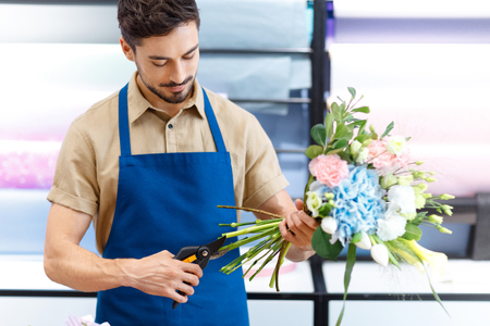Florist cutting flowersの写真素材