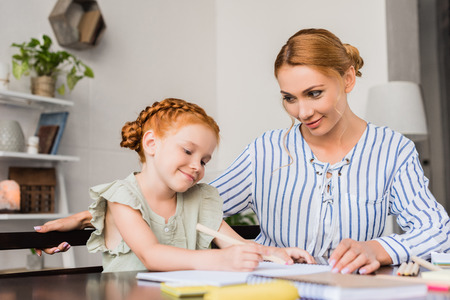 loving mother looking at daughterの写真素材