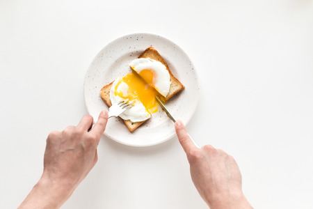 breakfast with fried egg on toastの写真素材