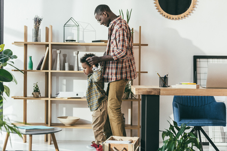 happy father and son in officeの写真素材