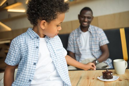 happy father and son in cafeの写真素材
