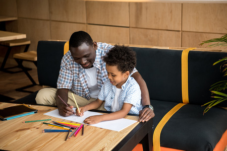 father and son drawing togetherの写真素材