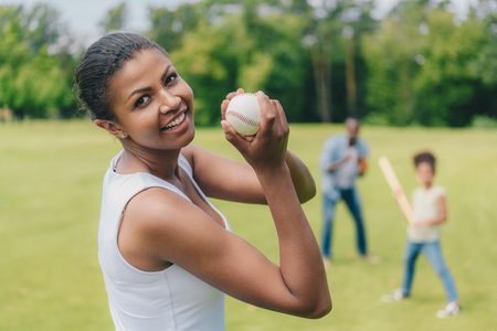 african american woman with baseball ballの写真素材