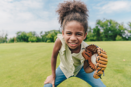 child playing baseball in parkの写真素材