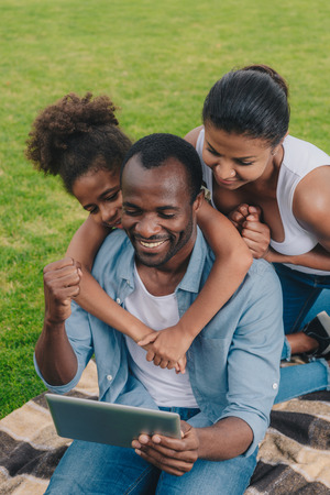 african american family with tabletの写真素材
