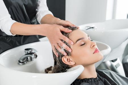 woman having hair washの写真素材