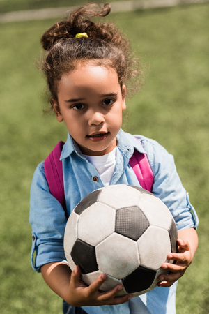 african american child with soccer ballの写真素材