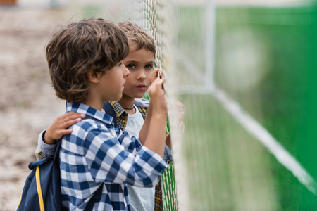 schoolboys on soccer fieldの写真素材