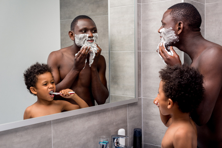 father and son in bathroomの写真素材