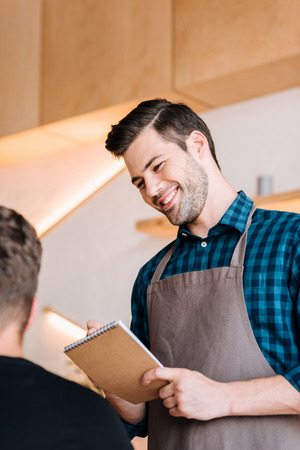 waiter taking order from clientの写真素材