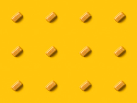 Set of iris milk candies isolated on yellowの写真素材