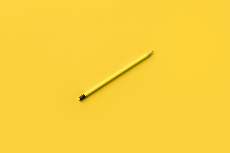 One Yellow pencil isolated on yellow