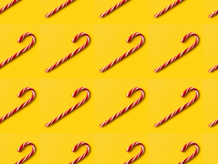 Set of candy sticks isolated on yellowの写真素材