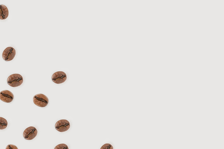 roasted coffee beans isolated on whiteの写真素材