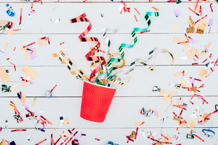 confetti spilling out of paper cupの写真素材