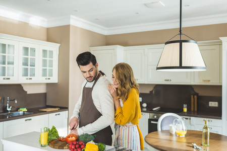Couple preparing vegetables
