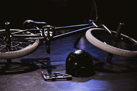 bmx bicycle, tools and helmet in studio の写真素材