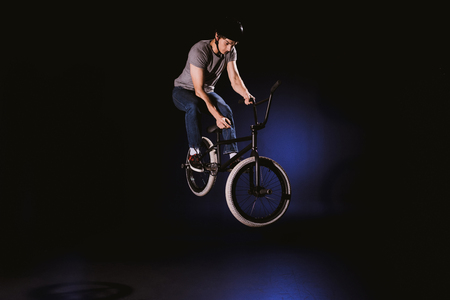 bmx cyclist performing stuntの写真素材