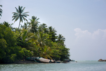 beautiful tropical island in sea on sunny summer dayの写真素材