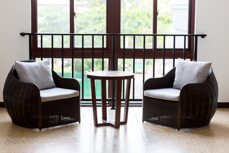 armchairs and coffee table in hotel roomの写真素材