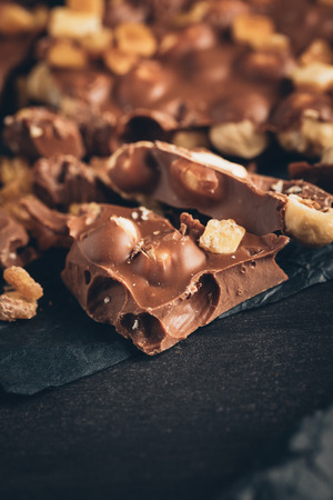 milk chocolate with nuts piecesの写真素材