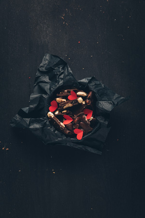 chocolate and red paper heartsの写真素材