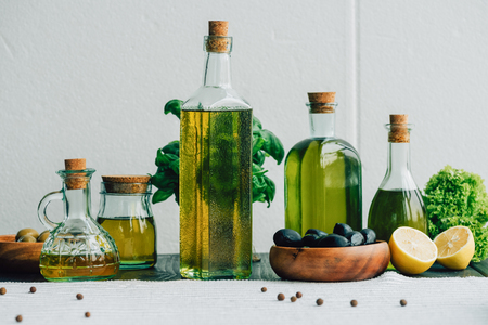 olive oil bottles with vegetablesの写真素材