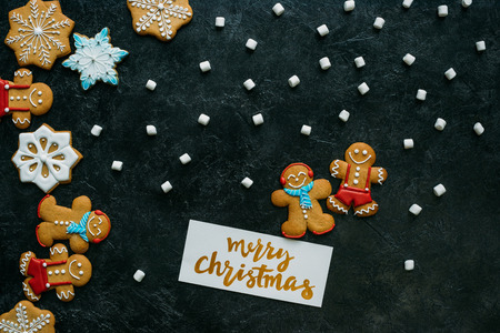 christmas gingerbreads, marshmallows and greeting cardの写真素材