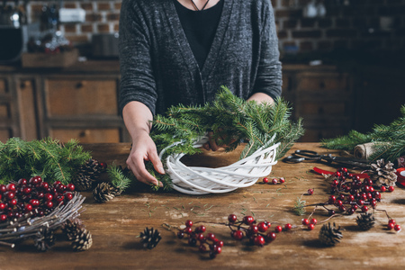 florist making Christmas wreathの写真素材