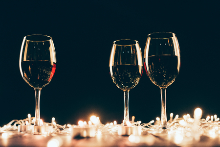 Glasses of wine and fairylightsの写真素材