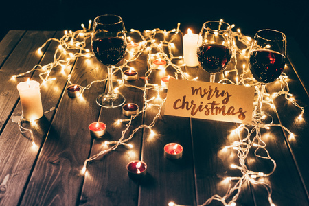 Red wine and merry christmas cardの写真素材