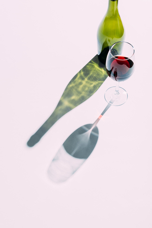 Glass and green wine bottleの写真素材