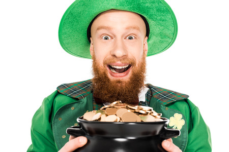 excited leprechaun holding pot of goldの写真素材