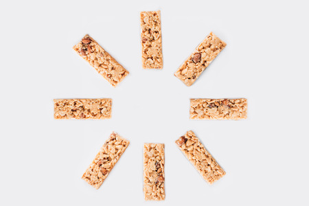 sun shaped granola bars isolated on white